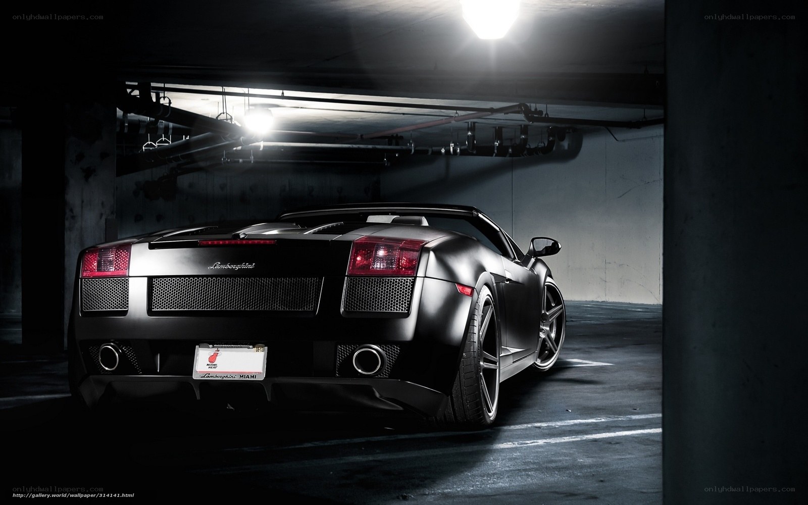 Black Lamborghini in parking garage