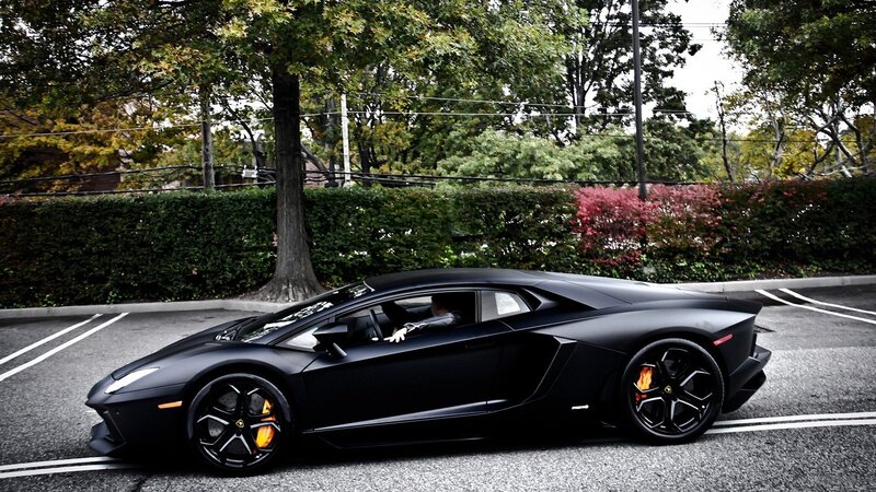 black lamborghini in parking lot