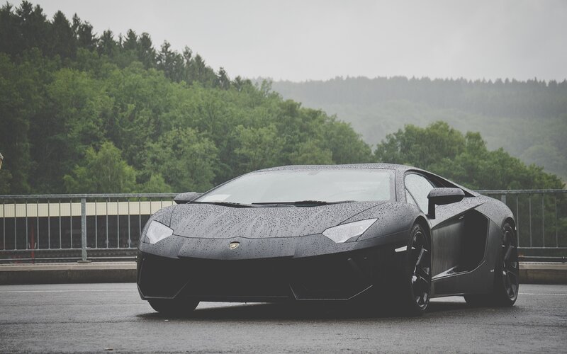 Black Lamborghini in Rain — Gray