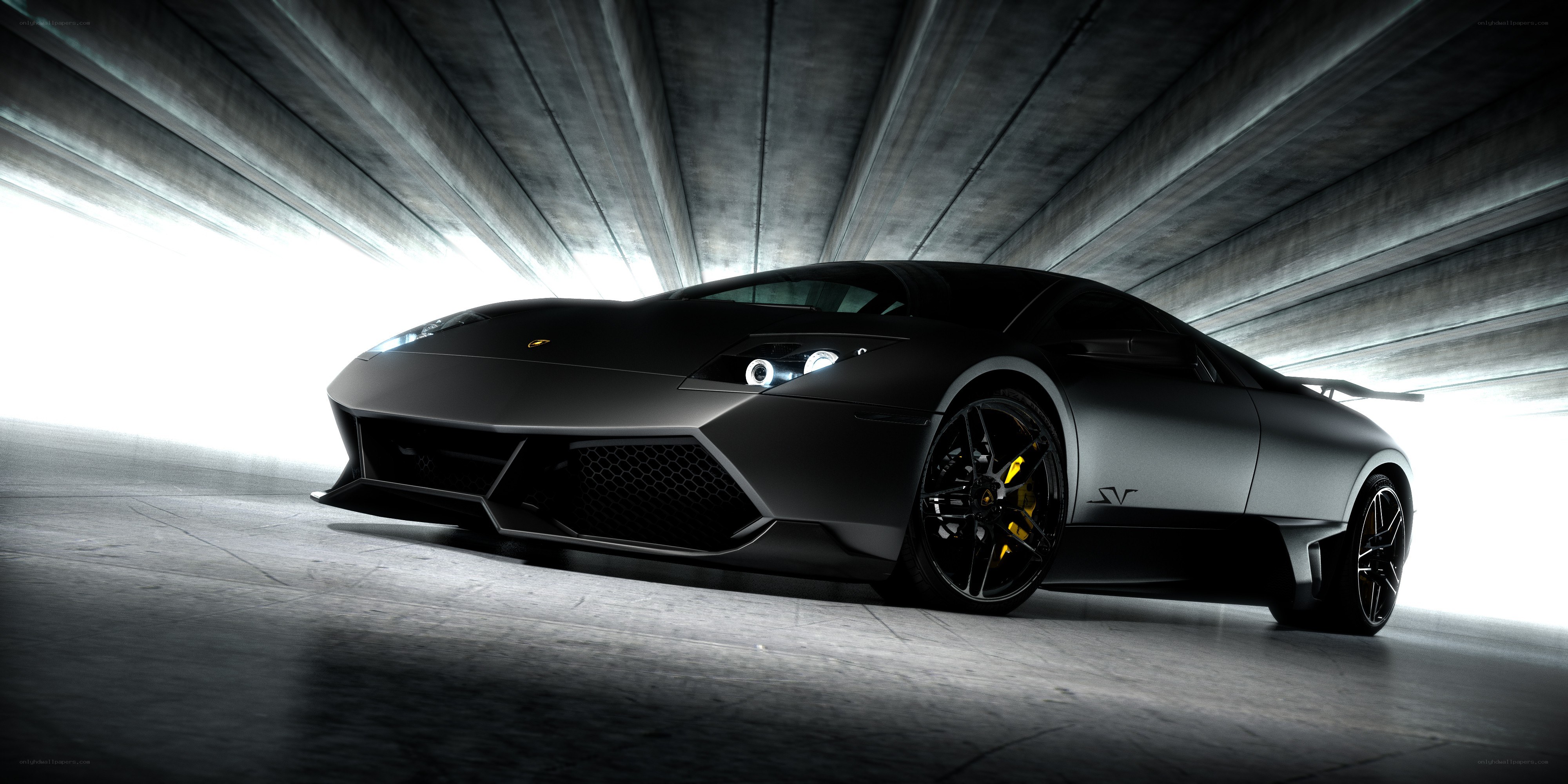 black lamborghini in tunnel