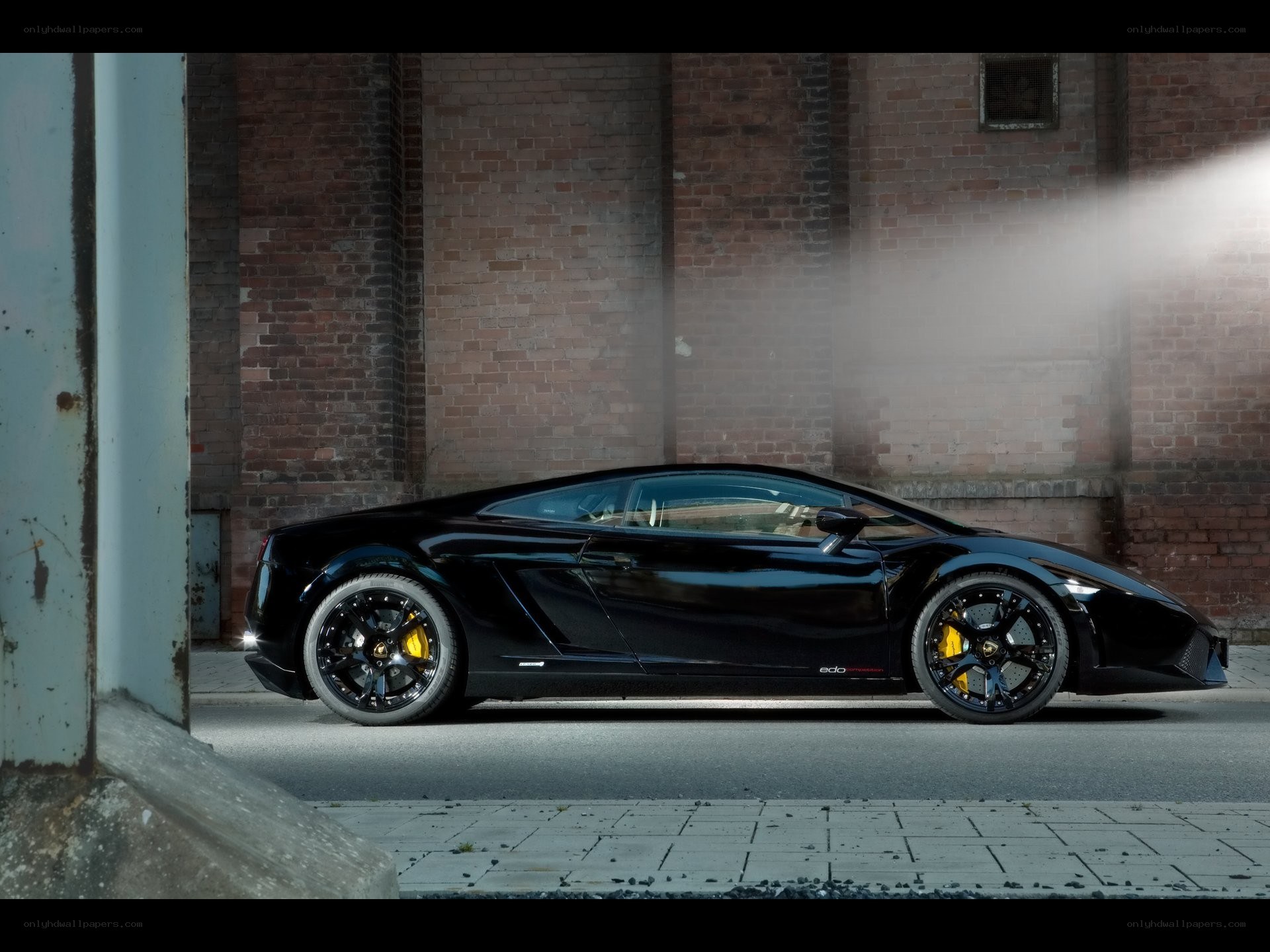 Black Lamborghini in urban setting