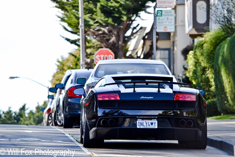 Black Lamborghini on a city street