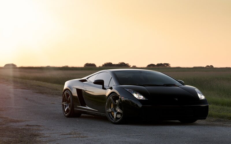 Black Lamborghini on a country road