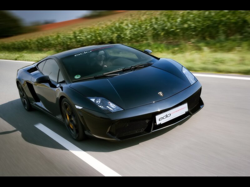 Black Lamborghini on a country road