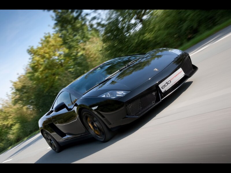 Black Lamborghini on a country road