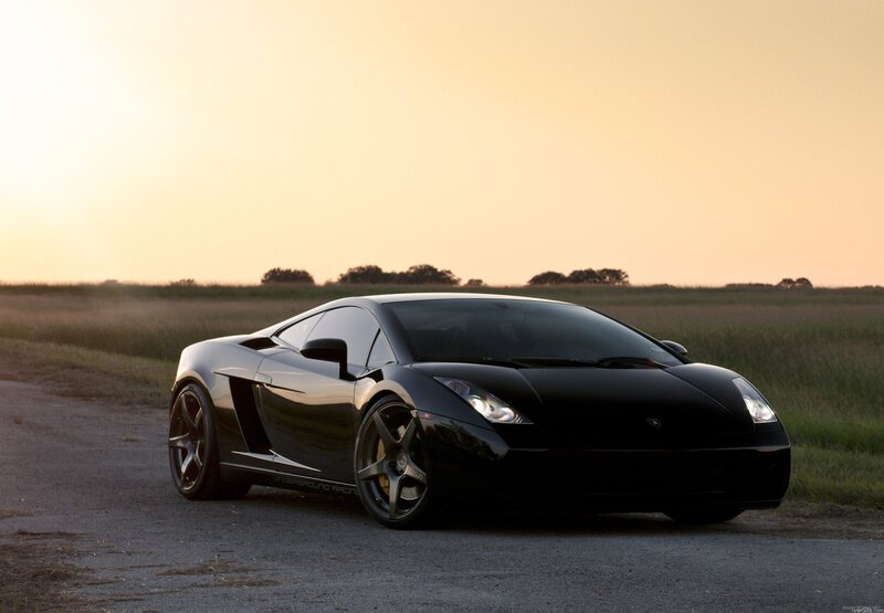 Black Lamborghini on a country road