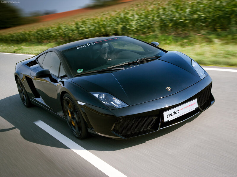 Black Lamborghini on a country road