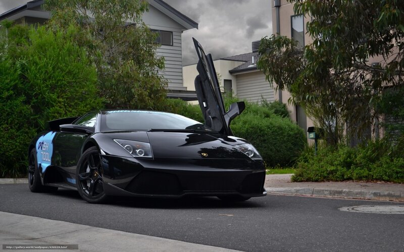 Black Lamborghini on a residential street