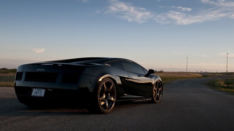 Black Lamborghini on a road