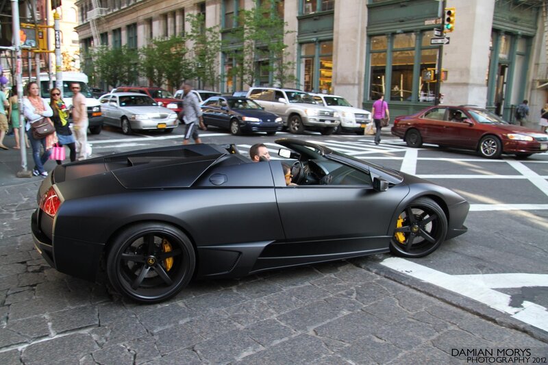 Black Lamborghini on city street
