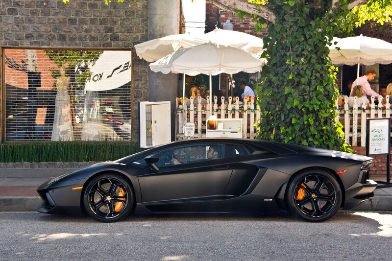 Black Lamborghini on city street