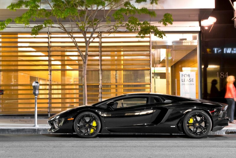 Black Lamborghini on city street