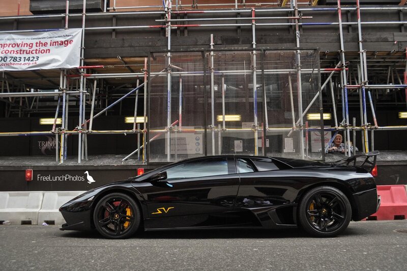 Black Lamborghini on city street