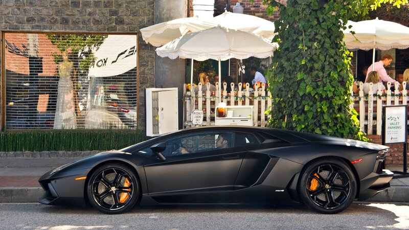 Black Lamborghini on city street