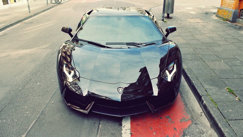 Black Lamborghini on city street