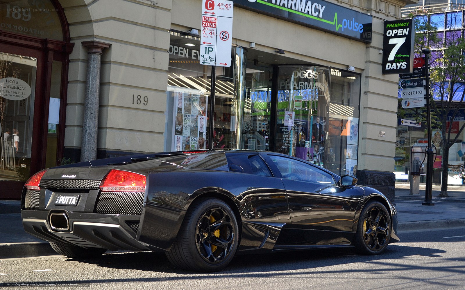 Black Lamborghini on city street