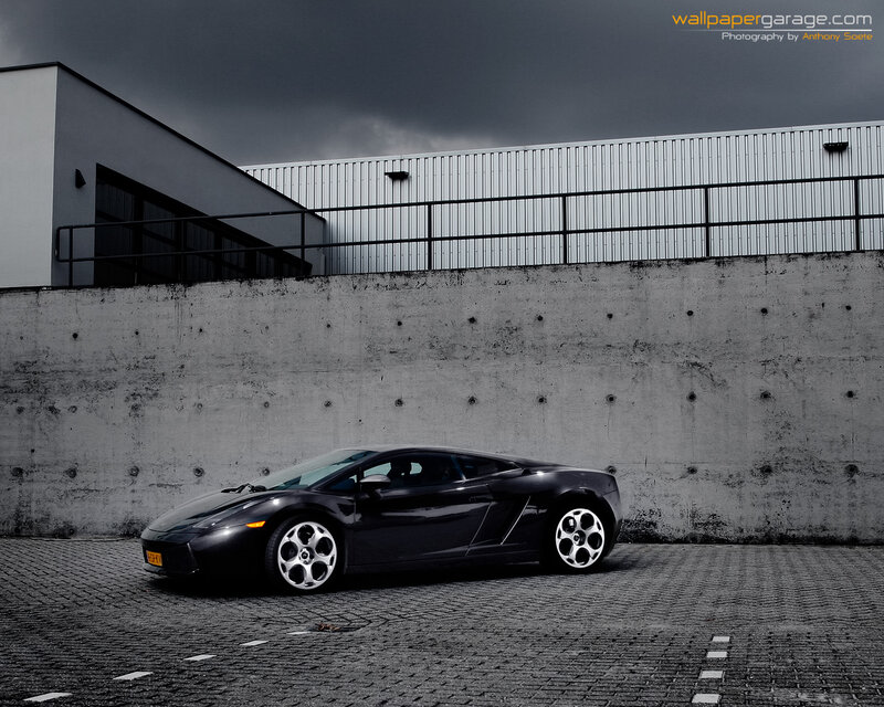 Black Lamborghini on cobblestones