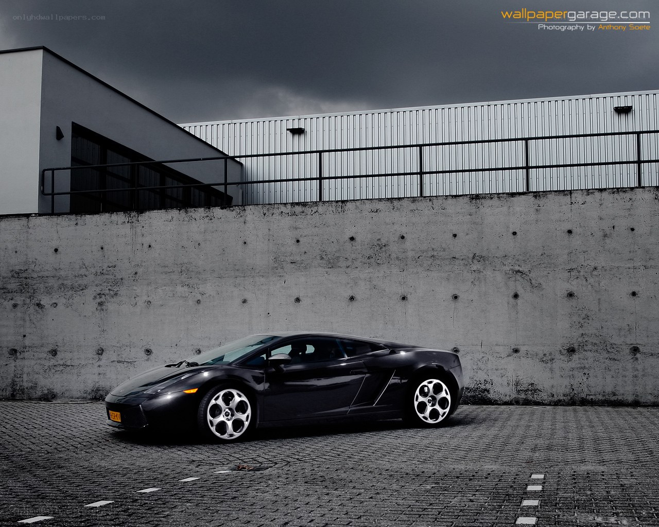 Black Lamborghini on cobblestones