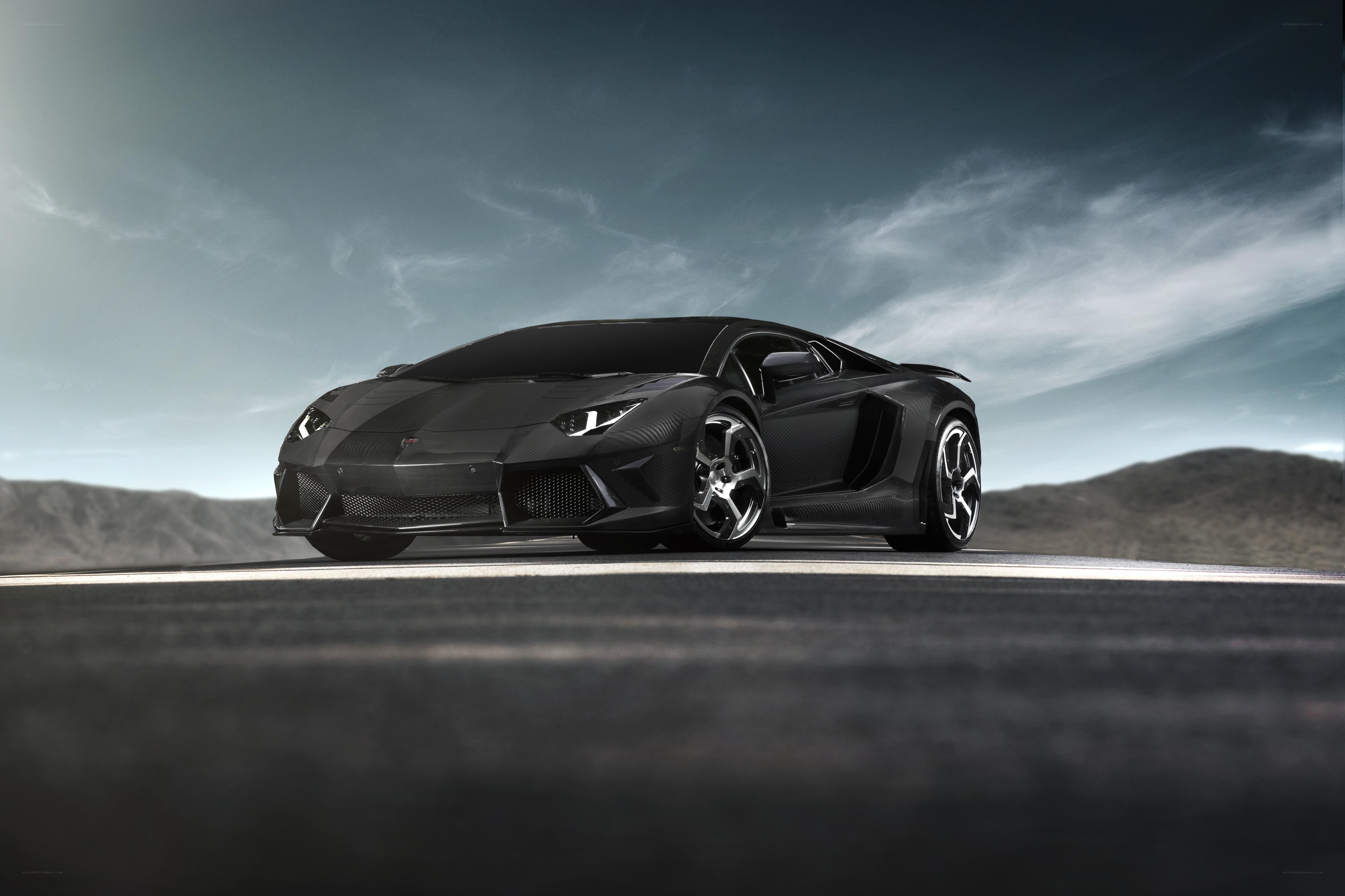 Black Lamborghini on desert road