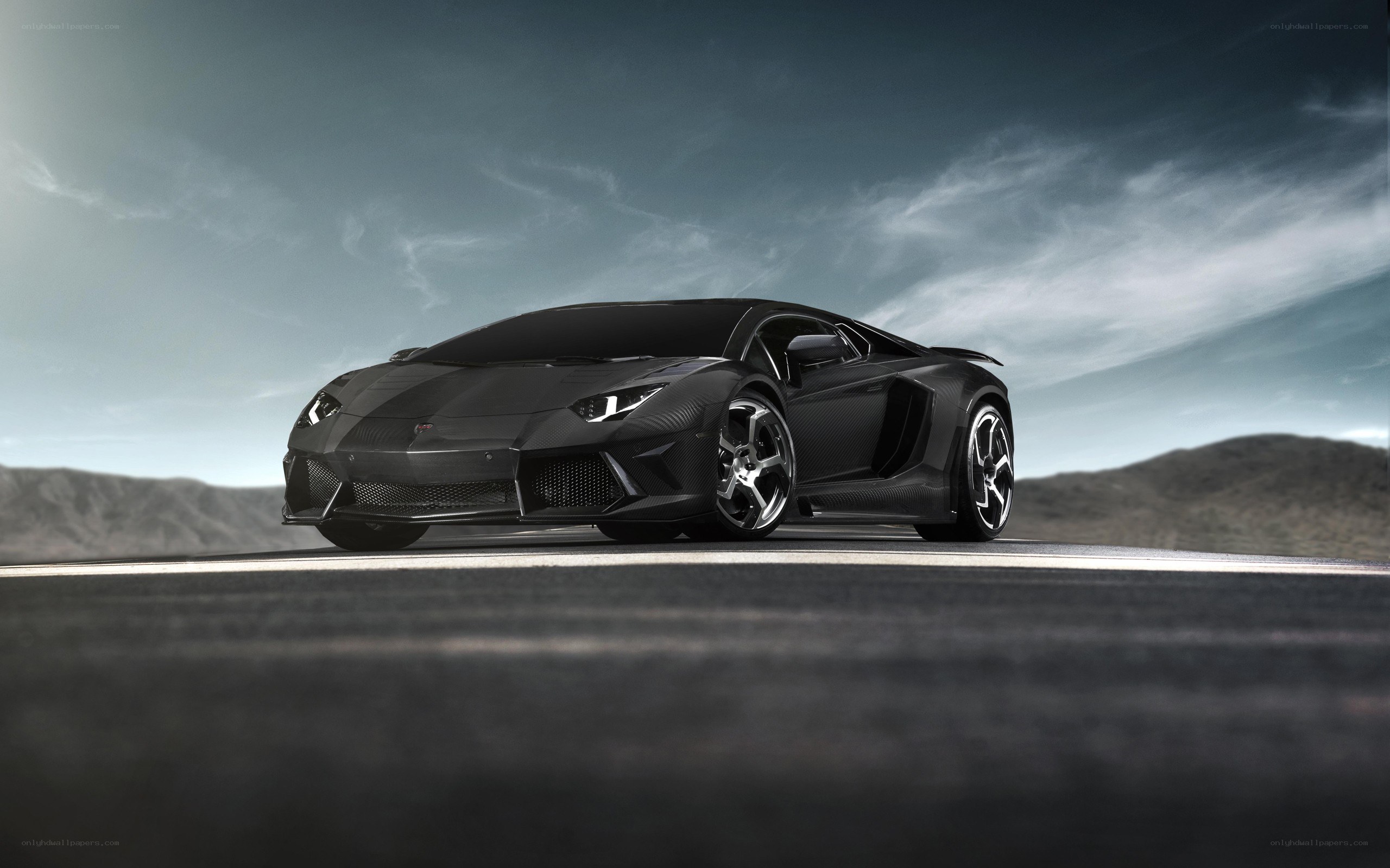 Black Lamborghini on desert road