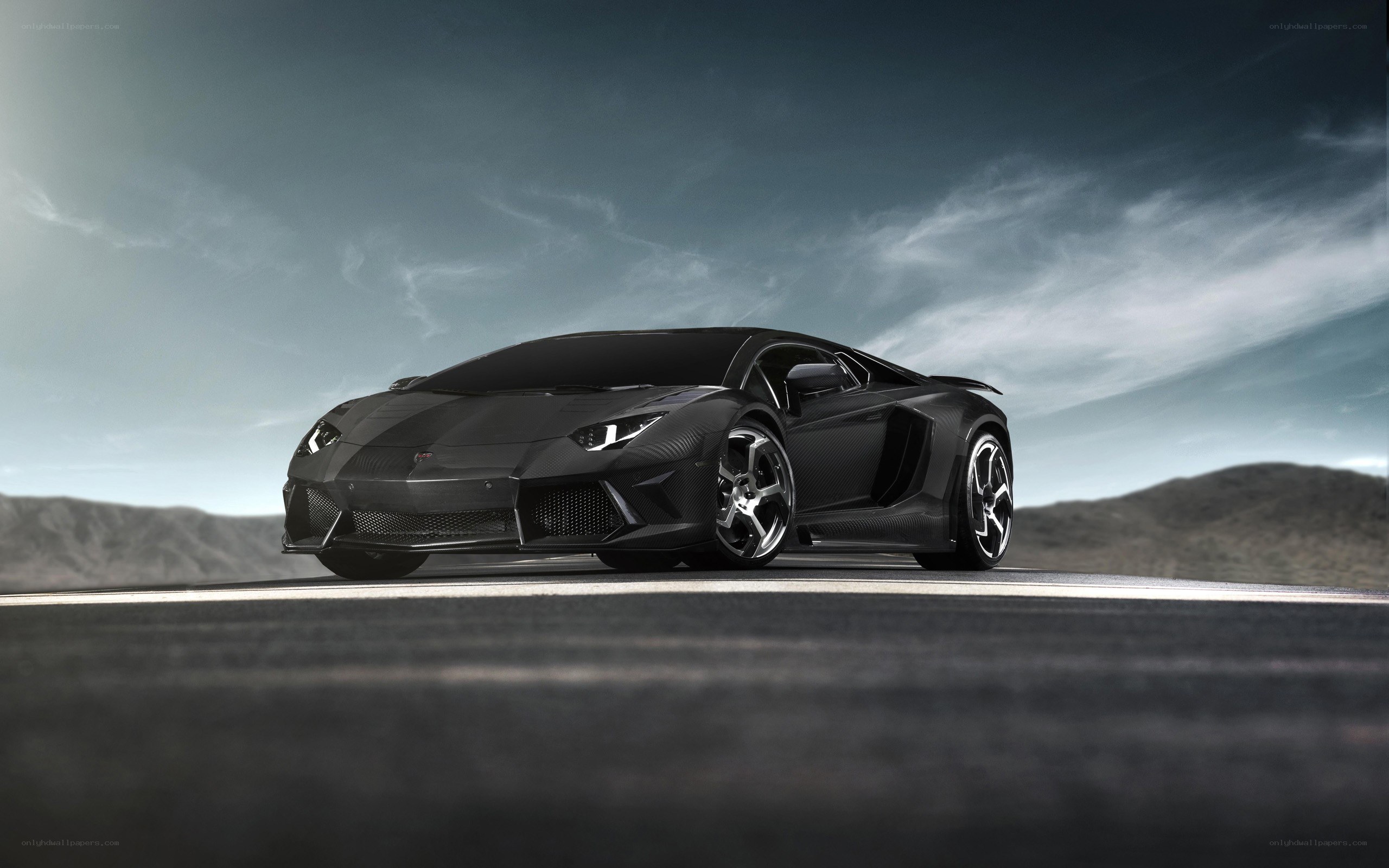 Black Lamborghini on desert road