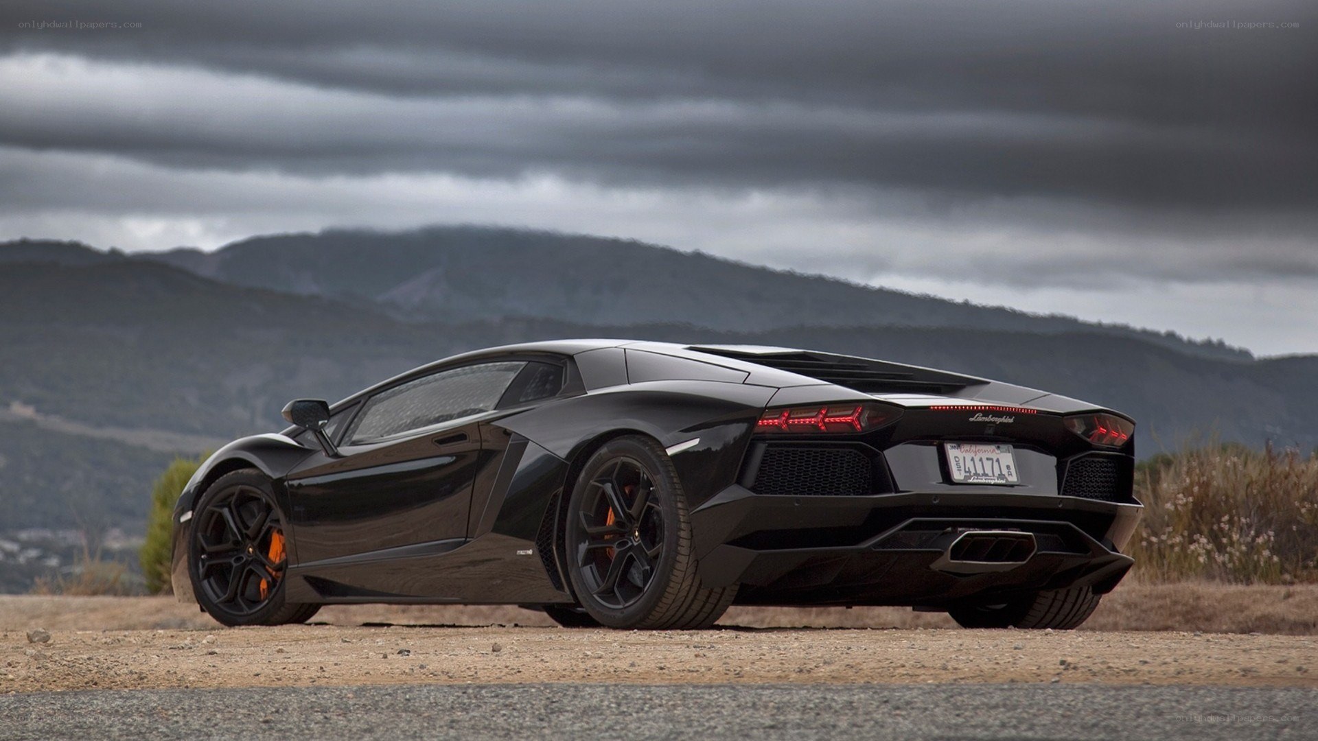 black lamborghini on dirt road