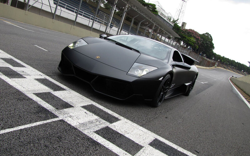 Black Lamborghini on racetrack