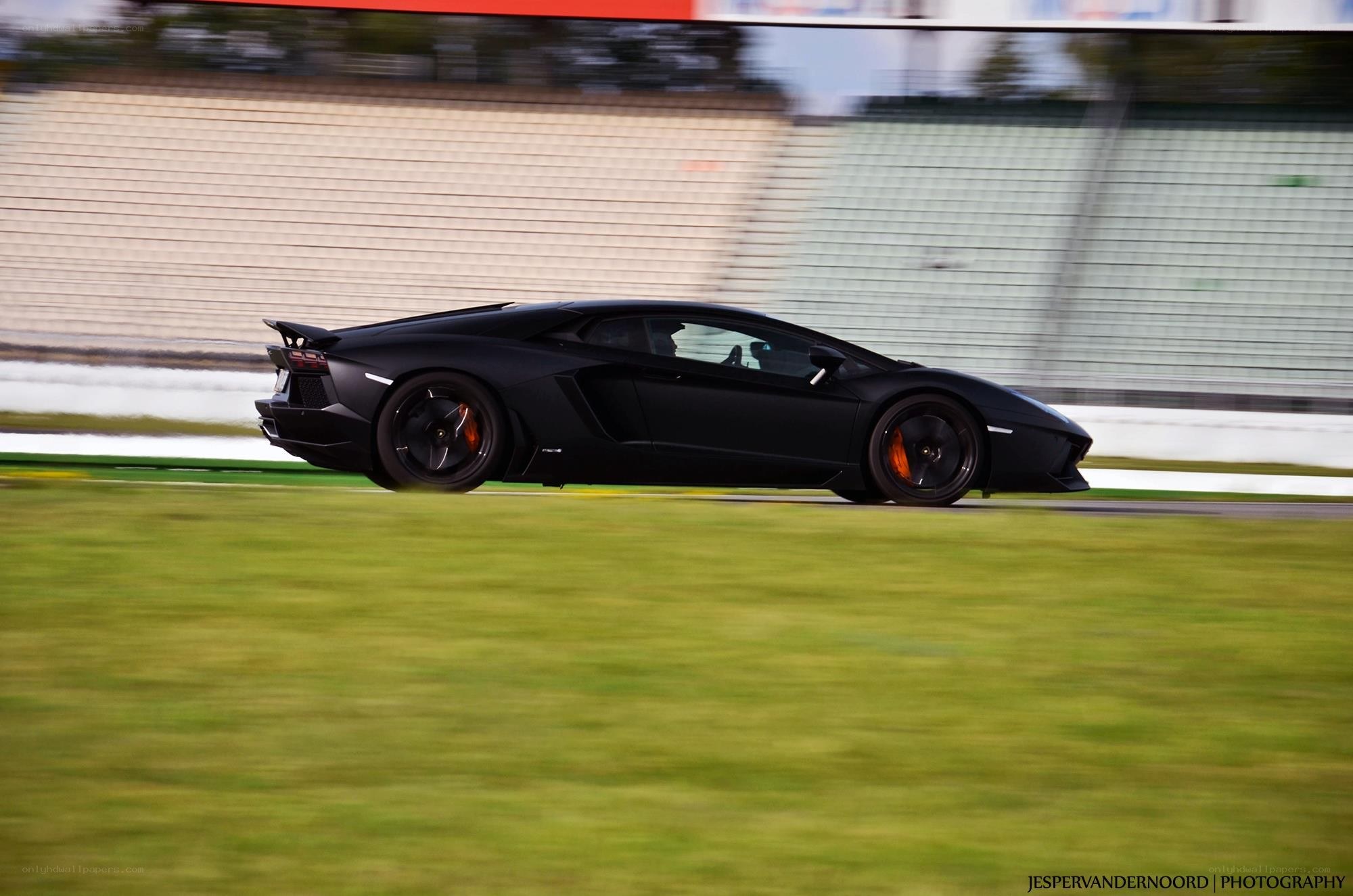 black lamborghini on racetrack