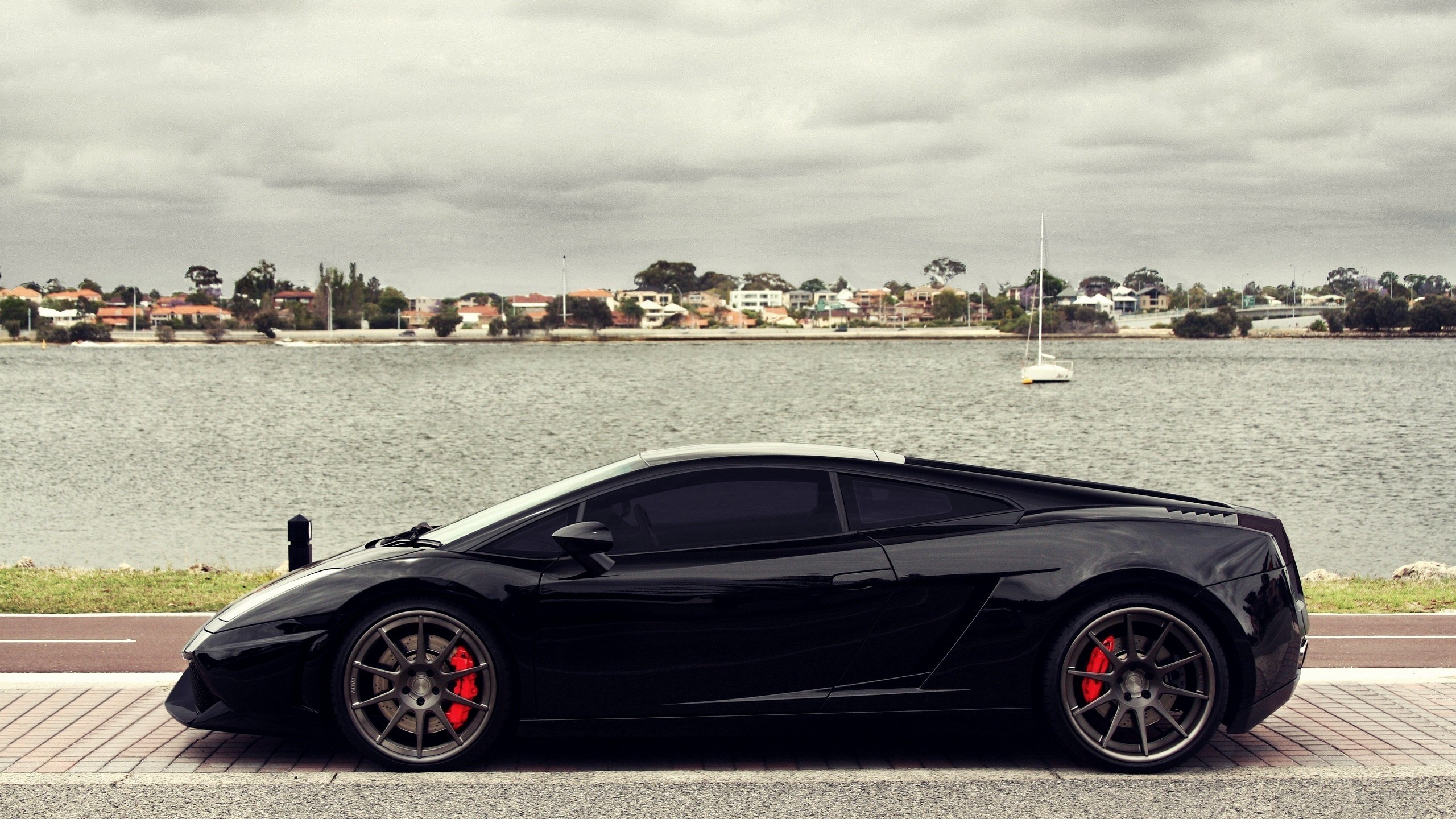 Black Lamborghini on waterfront