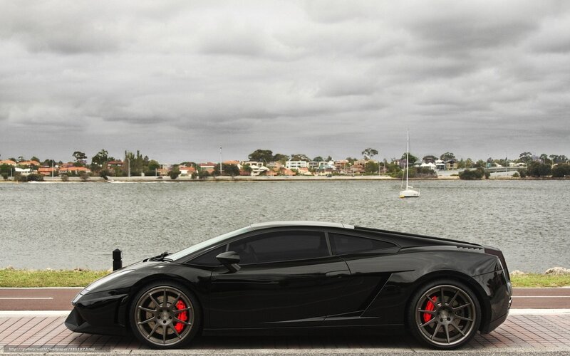 Black Lamborghini on waterfront