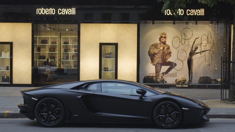 Black Lamborghini outside Roberto Cavalli