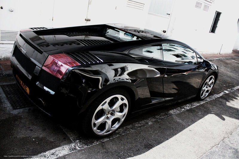Black Lamborghini parked in lot