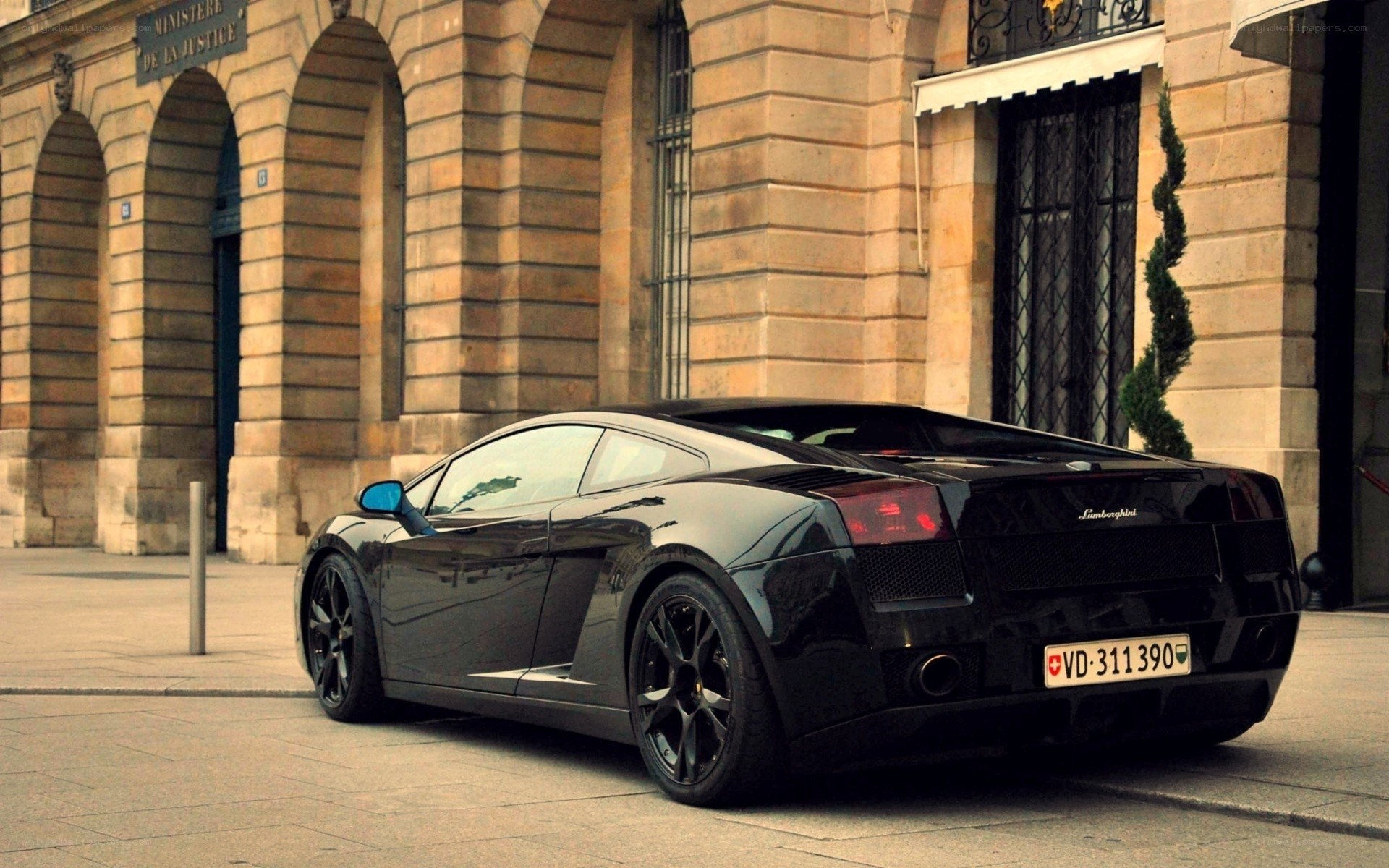Black Lamborghini parked in Paris