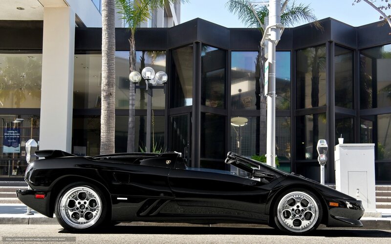 Black Lamborghini parked on street