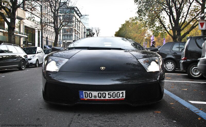 Black Lamborghini parked on street