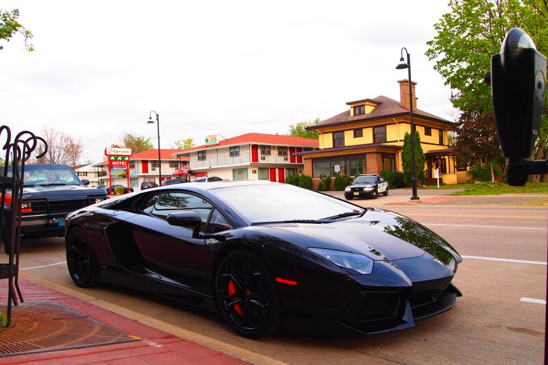 Black Lamborghini parked on street