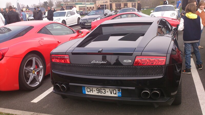 Black Lamborghini Sports Car — Crowded