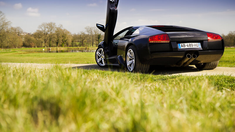 Black Lamborghini Sports Car — Green