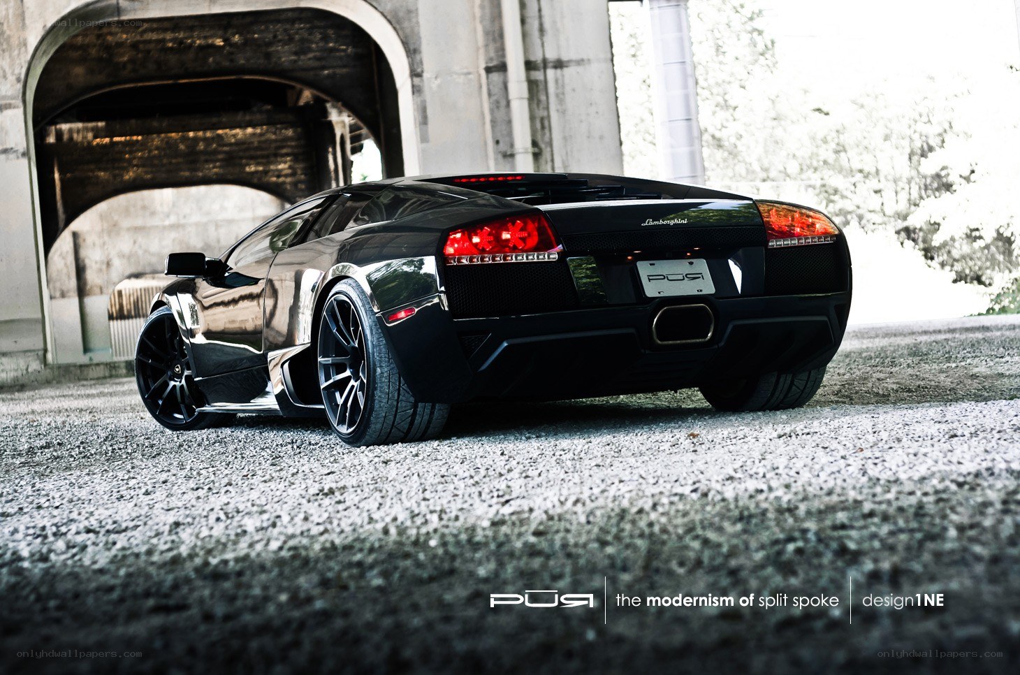 black lamborghini under bridge