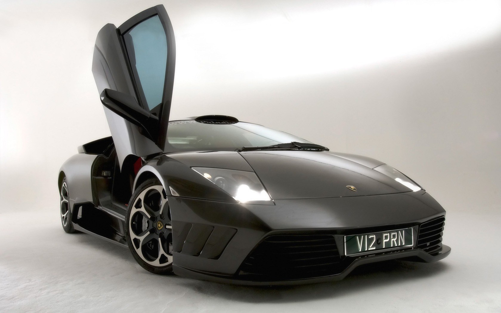Black Lamborghini with doors open