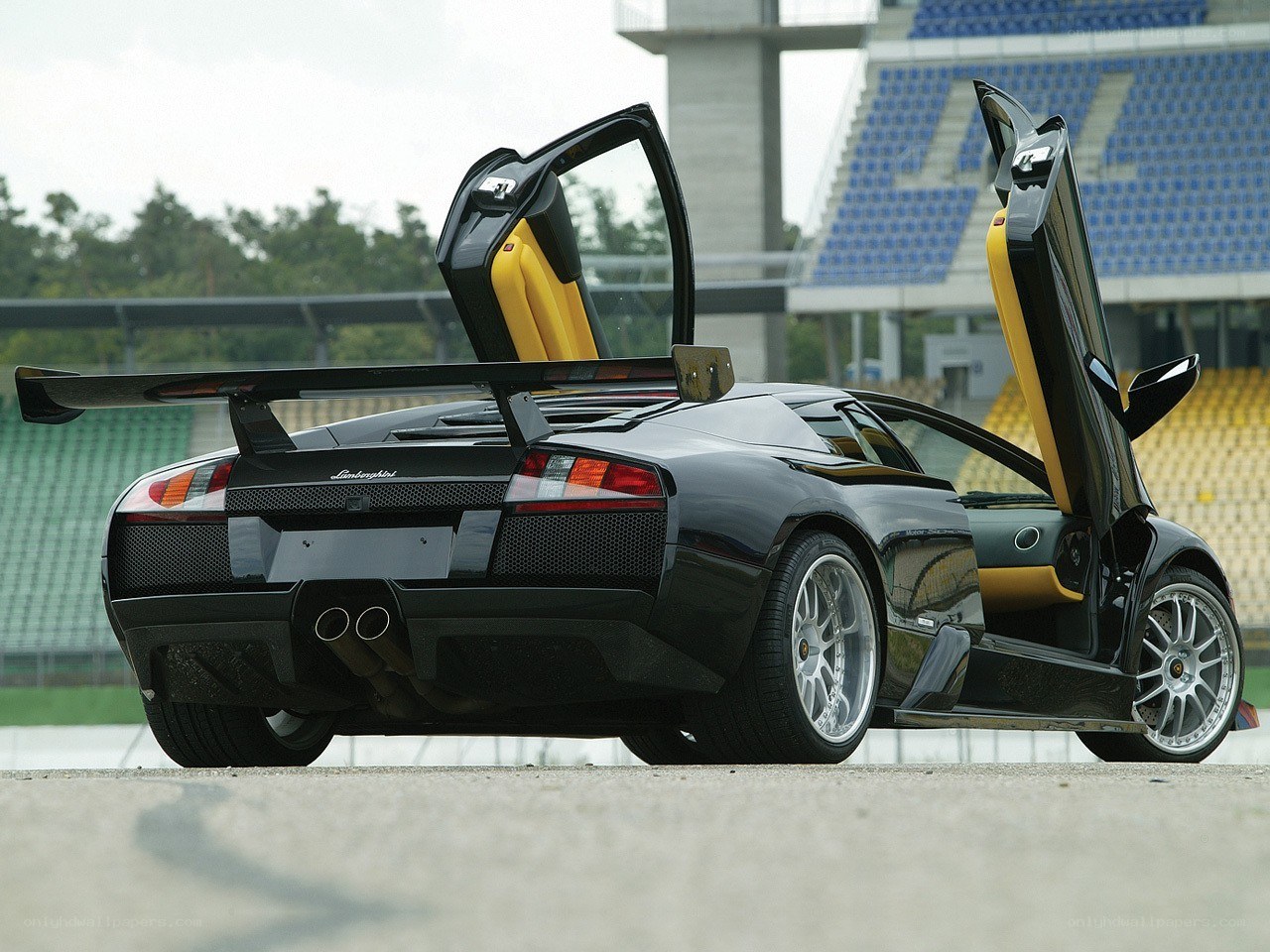 Black Lamborghini with doors open