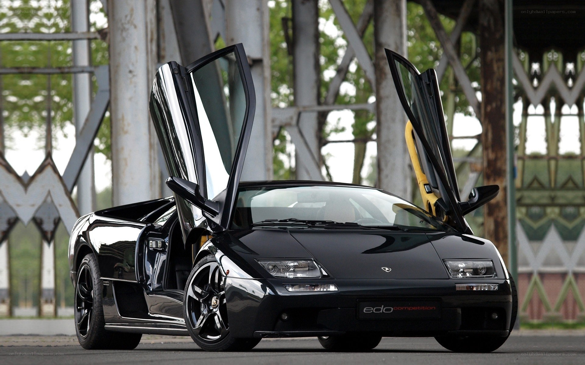 Black Lamborghini with doors open