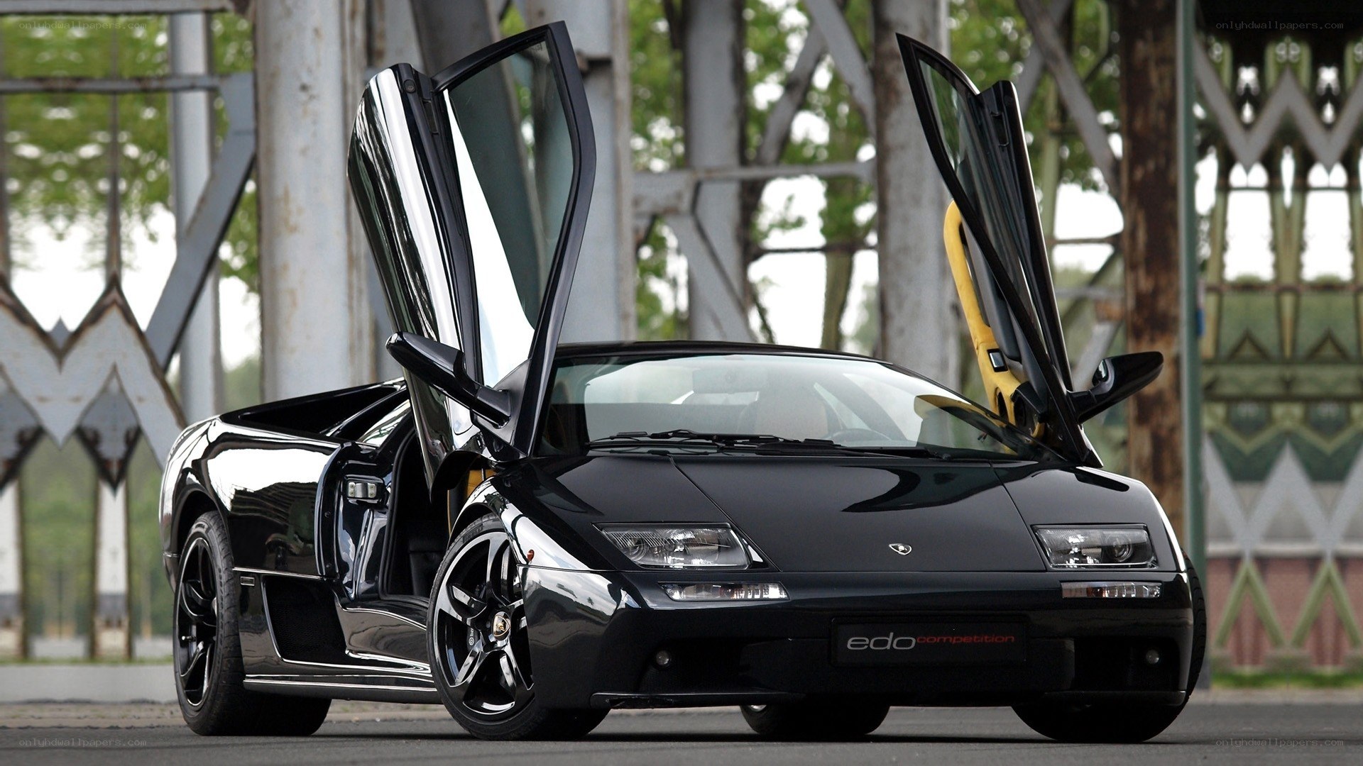 Black Lamborghini with doors open