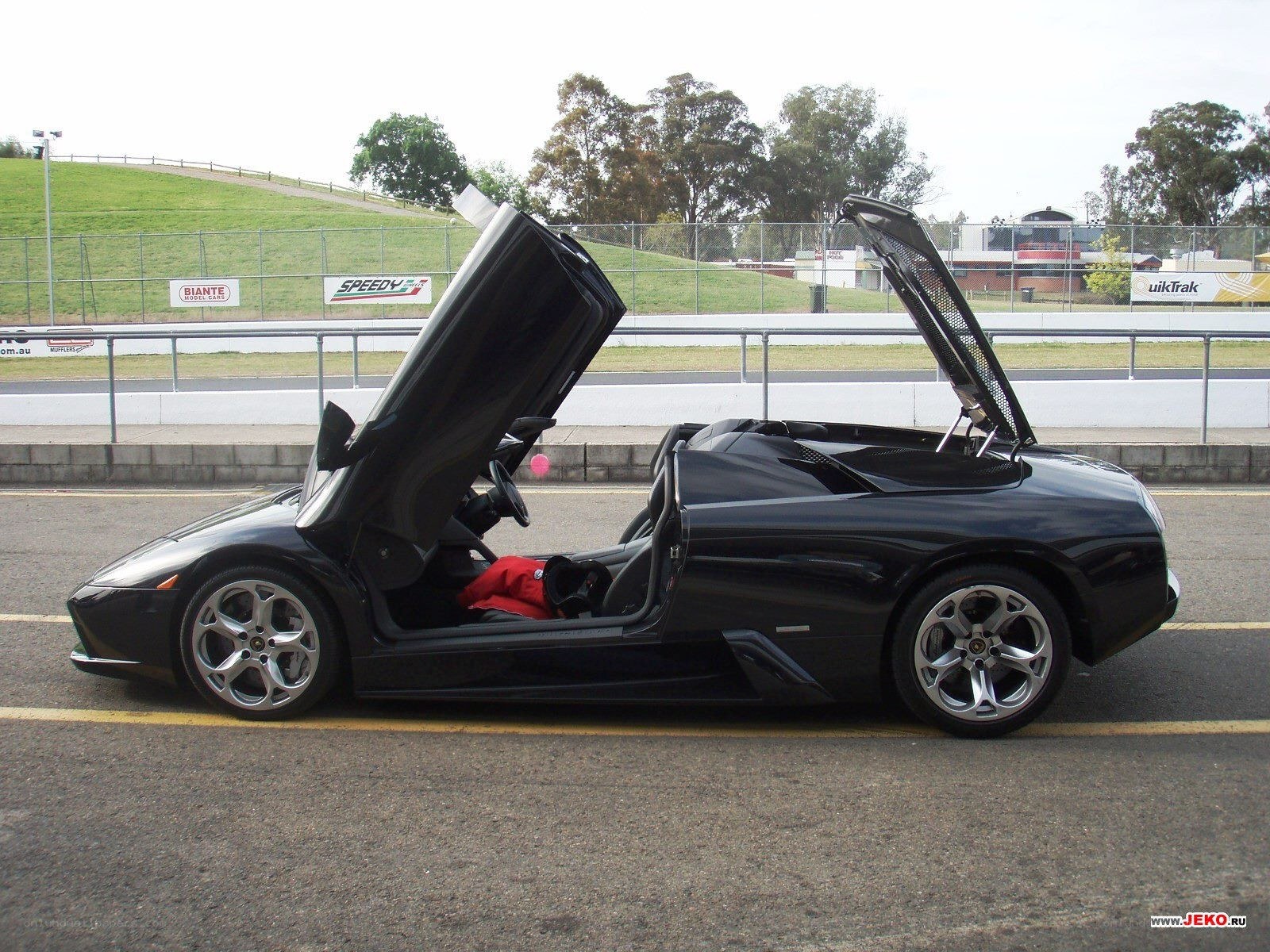 Black Lamborghini with doors open