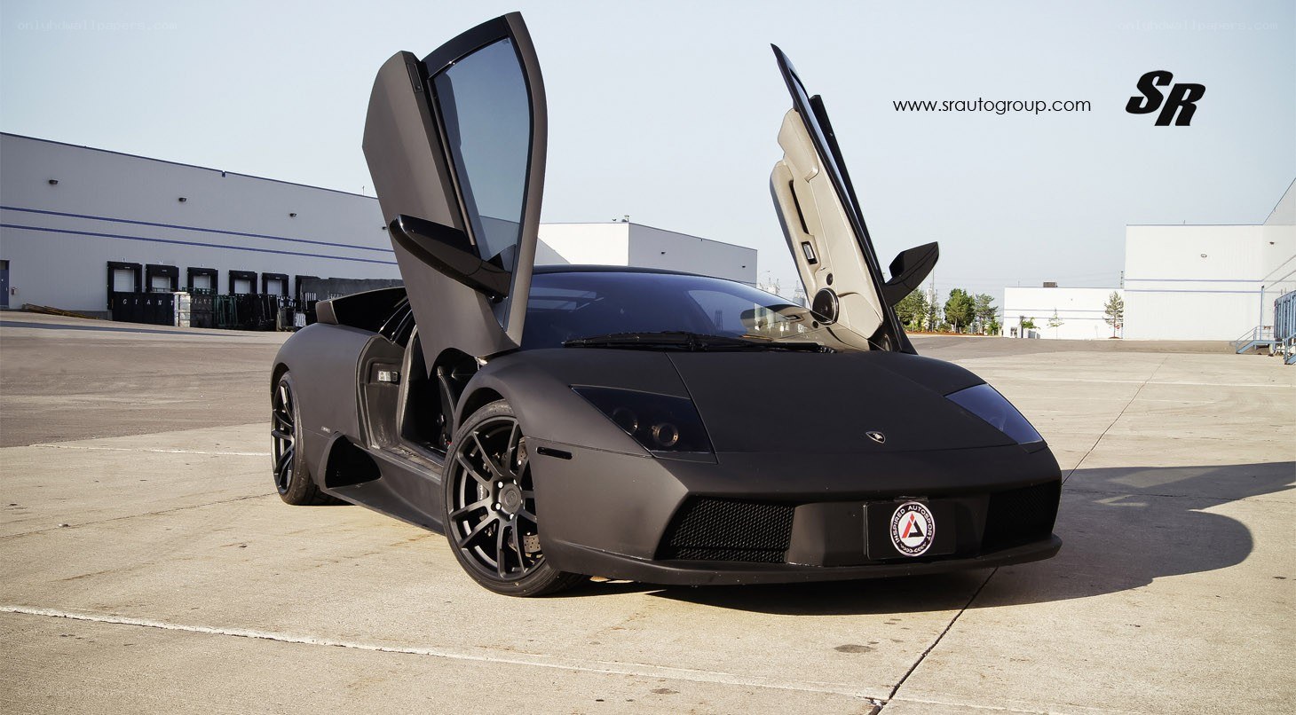 Black Lamborghini with doors open