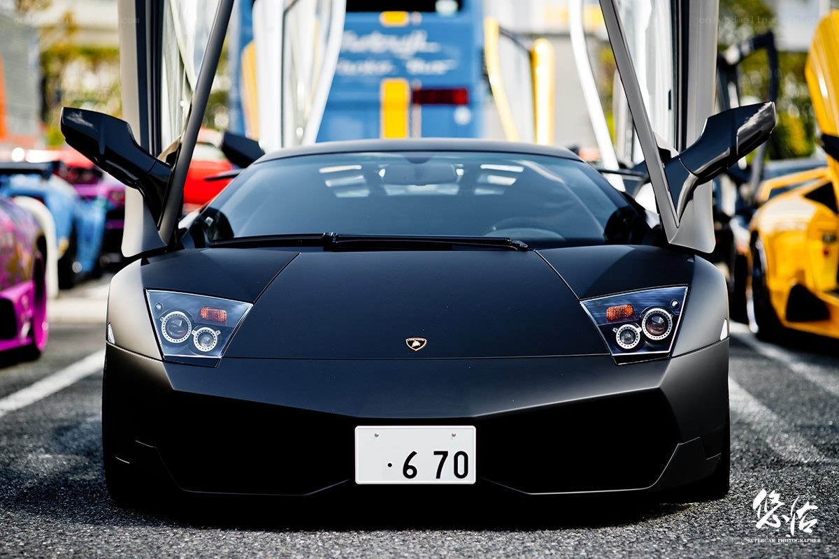 Black Lamborghini with doors open