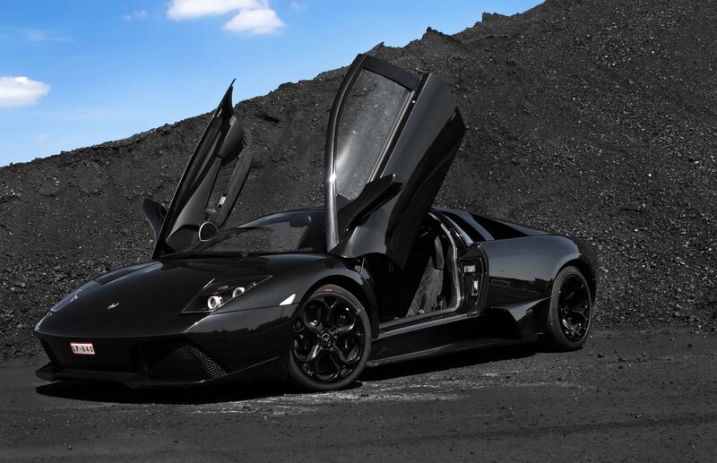 Black Lamborghini with doors open