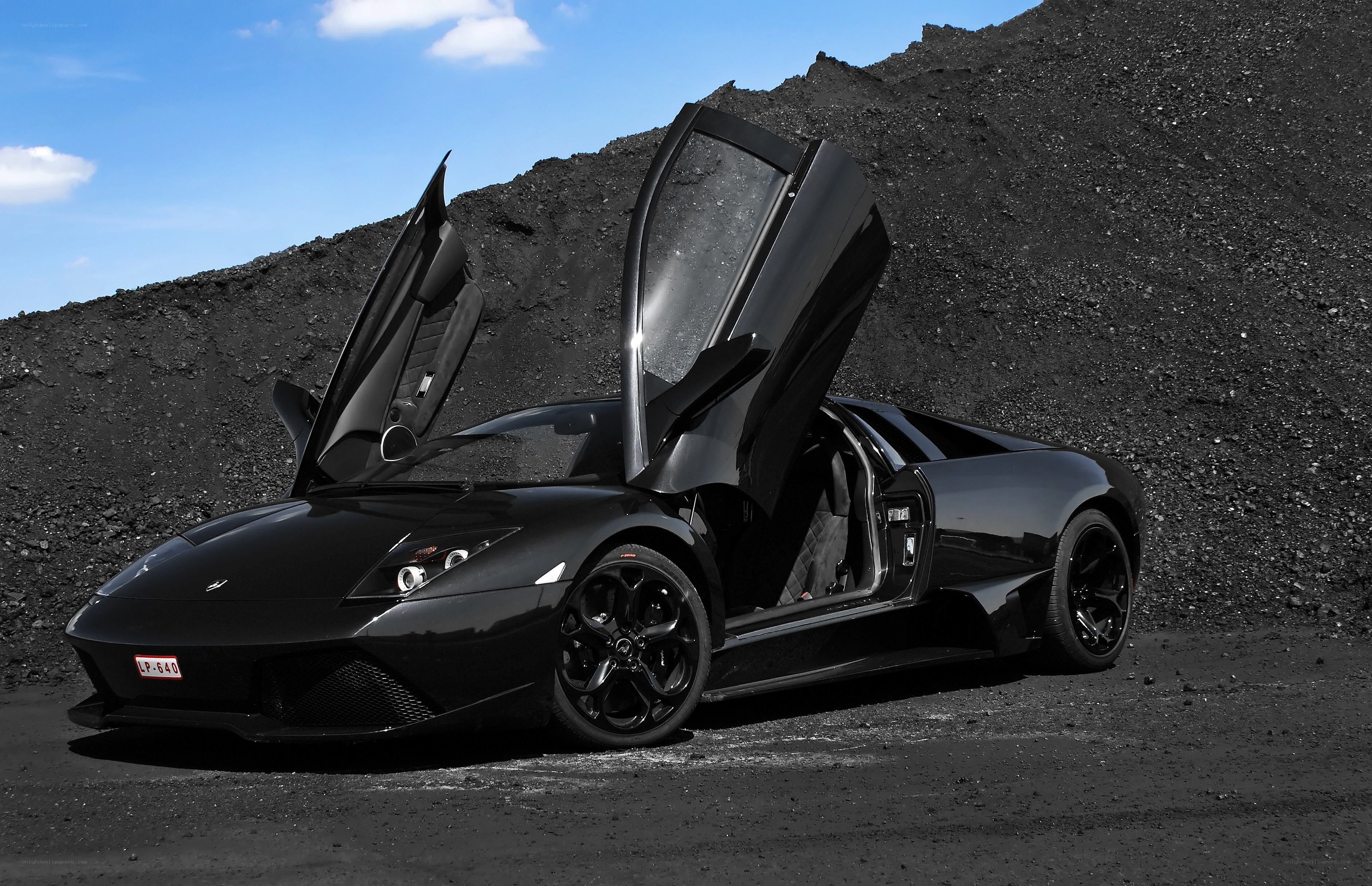Black Lamborghini with doors open