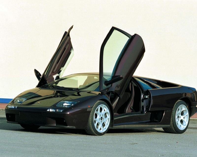 Black Lamborghini with doors open