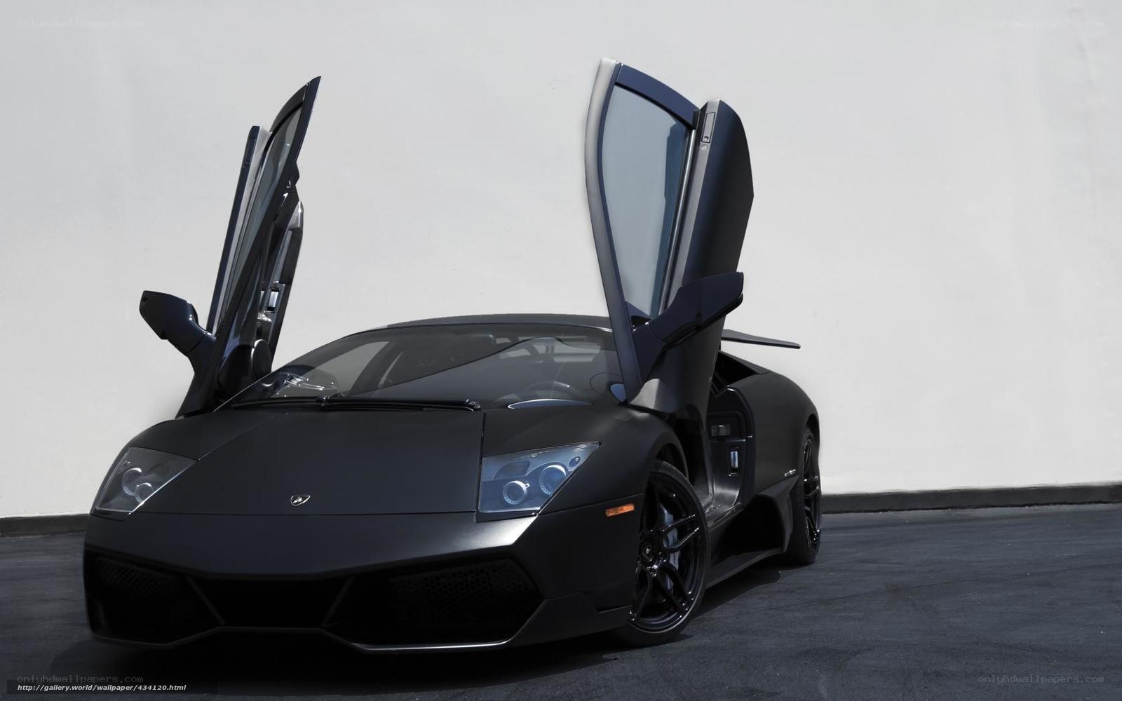 Black Lamborghini with doors open